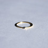 Thin hammered ring with sapphire