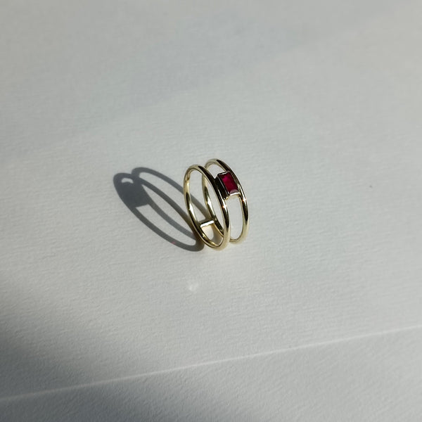 Gold ring with ruby and two bands